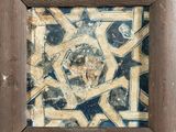 a picture of a picture of a tile in a wooden frame