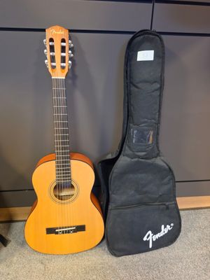 a guitar and a guitar case next to each other