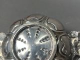 a silver object that is sitting on a table