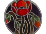 a picture of a stained glass rose in a circle