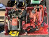 a red box with tools in it sitting on the floor