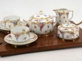 a picture of a tea set on a wooden tray
