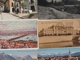 four postcards of a view of a town with a bridge over a river