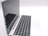 two laptops sitting side by side on a white surface