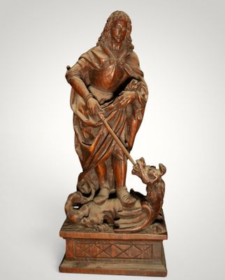 a statue of a man with a dog on a pedestal