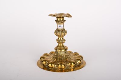 a gold candle holder on a white background