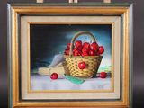 an oil painting of a basket of cherries on a easel