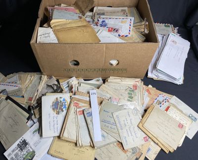 a box full of old letters and envelopes sitting on a table