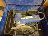 a blue tool in a blue box on a table