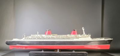 a model of a cruise ship on display on a table