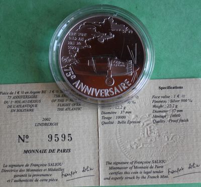 an image of a commemorative coin on top of a piece of paper