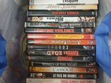 a lot of dvds in a bag on the bed