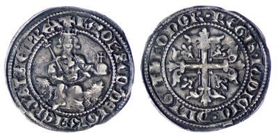 une pièce d'argent avec une croix au recto et une croix au verso