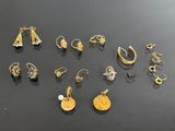 a close up of a bunch of earrings on a table