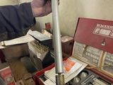 a man that is holding a tool in his hand