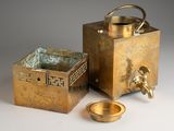 a small brass box with a handle and a small brass bowl