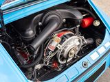 a small engine in the trunk of a blue car