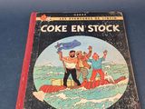 un livre sur lequel figure la photo d'un homme dans un bateau sur l'eau