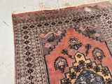 a rug on the floor with a cat laying on it