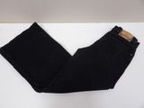 a pair of black jeans sitting on top of a white table