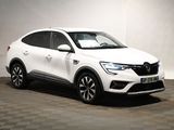 the white car is parked in a room with a checkered floor