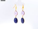 a pair of purple and blue stone earrings on a white background