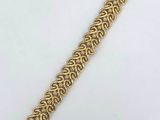 a gold plated bracelet with a chain link