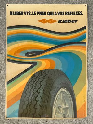 an advertisement for a tire with a colorful swirl pattern on it