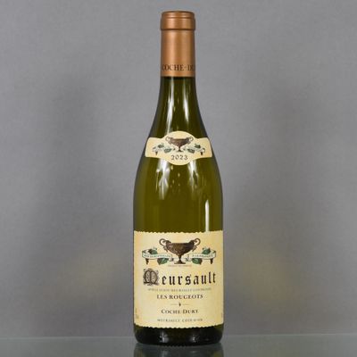 a bottle of wine that is sitting on a table