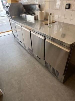 a stainless steel counter top in a commercial kitchen
