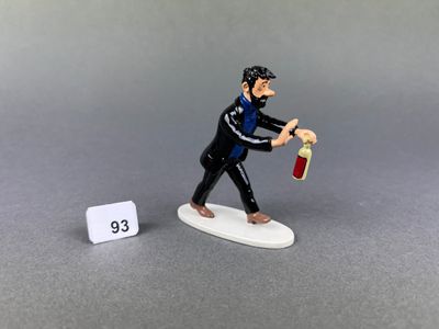 a figurine of a man holding a bottle of wine