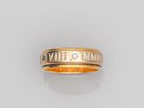 a gold ring with roman numerals on it