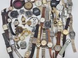 many different types of watches on a white surface