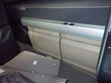 a picture of a car with the door open and the seat down
