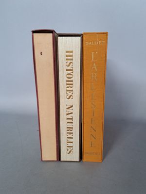 three books are stacked on top of each other on a table