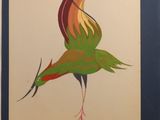 painting of a colorful bird in a blue frame on a white wall
