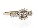 a close up of a diamond ring on a white background