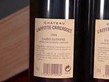 two bottles of wine that are on a table