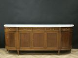 a large antique sideboard with marble top