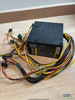an image of a computer power supply unit on a wooden floor