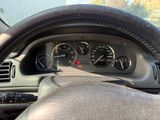 a close up of a car dashboard with a steering wheel