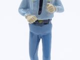 a figurine of a man in a police uniform