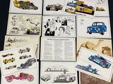 a lot of old race cars on display on the table