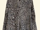 a leopard print shirt with a long sleeves and a collar