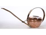 an old copper watering can with a metal handle and handle