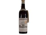 an old bottle of wine with a tag on it