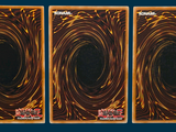 three cards that have a picture of a black hole in them