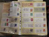 a open book with stamps on it sitting on a table