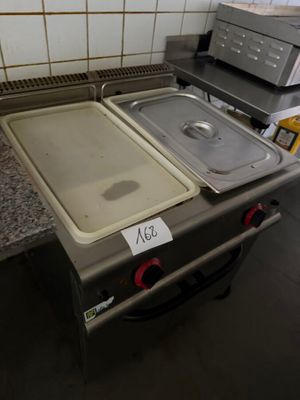 an image of a kitchen with a stove and a sink