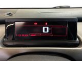 a digital clock on the dash of a car